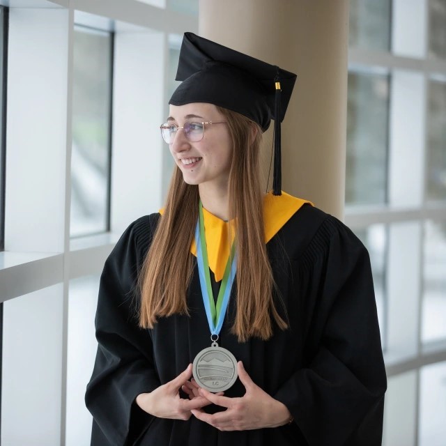 Picture of Valedictorian holding medal 