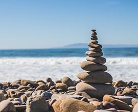 Stacked stones by beach