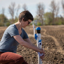 Dr. Willemijn Appels checking irrigation research equipment on the research farm.