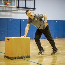 Instructor Florian Linder demonstrates box pushes for students.