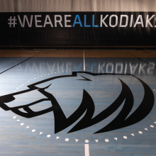A Kodiaks logo painted on a gym floor