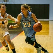 Kodiaks forward Amy Arbon drives the basket in an ACAC basketball game