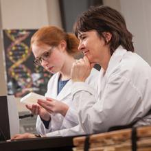 Dr. Sophie Kernéis (foreground) works in a Lethbridge College laboratory with student Megan Puchbauer.