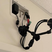 a video camera mounted on the wall in an interview room.