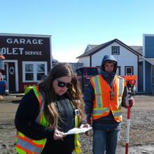 Geomatics Engineering Technology students Ashley Burns (left) and Kage Hellman (right) work as part of a partnership with Coyote Flats Pioneer Village.