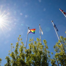 The Progressive Pride Flag flies outside the Lethbridge College main campus.
