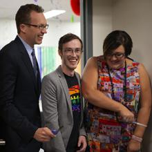 Hon. Marlin Schmidt, Zachary Wigand and Kristin Ailsby officially open Lethbridge College's Pride Lounge.