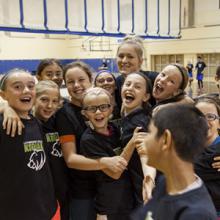 Children pose while participating in a Kodiaks Athletics summer camp.