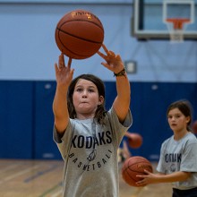 A camper takes part in a Kodiaks basketball summer camp. 
