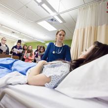 Nursing Education in Southern Alberta (NESA) students practice skills in a nursing lab.