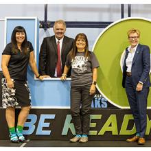 The college's Executive Leadership Team poses with the Be Ready sign.
