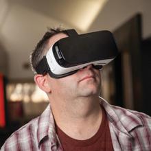 Multimedia Production instructor Mike McCready models a virtual reality headset