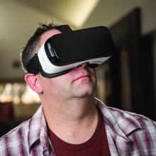 Mike McCready wears a virtual reality headset.