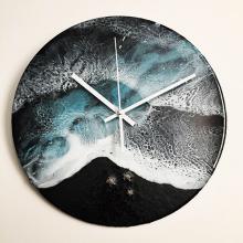 A clock with a beach scene on its face