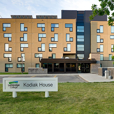A building with a sign out front that reads Kodiak House